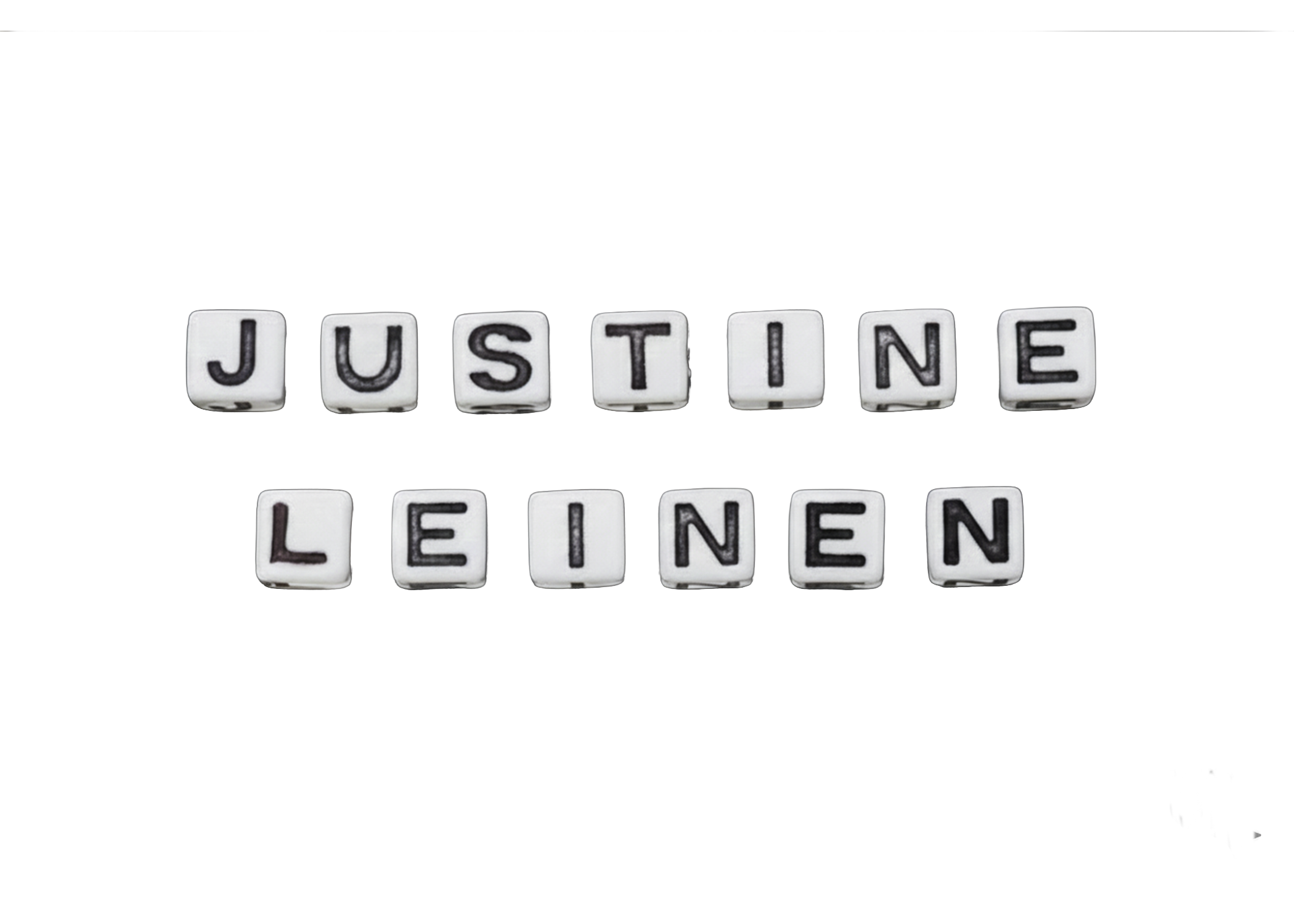 Scrabble letters that say Justine Leinen